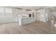 Modern kitchen featuring a center island with stainless appliances and white cabinets at 722 Crossroad Ct, Powder Springs, GA 30127