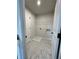 Well-equipped laundry room with marble floors, washer/dryer hookups, and storage options at 722 Crossroad Ct, Powder Springs, GA 30127