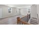 Spacious living room with hardwood floors, natural light, and wooden railing at 722 Crossroad Ct, Powder Springs, GA 30127