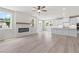 Spacious living room featuring an electric fireplace, light-colored flooring, and bright windows at 722 Crossroad Ct, Powder Springs, GA 30127