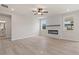 Modern living room featuring a sleek electric fireplace and plenty of natural light at 722 Crossroad Ct, Powder Springs, GA 30127
