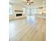 Bright living room features light wood floors, a fireplace and abundant natural light at 722 Crossroad Ct, Powder Springs, GA 30127
