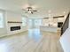 Bright living room with fireplace, hardwood floors and lots of natural light at 722 Crossroad Ct, Powder Springs, GA 30127