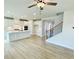 Open-concept living space featuring hardwood floors and modern staircase leading to the upper level at 722 Crossroad Ct, Powder Springs, GA 30127