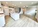Bright and open living space connecting the kitchen and living room, offering ample space for entertaining and Gathering at 722 Crossroad Ct, Powder Springs, GA 30127