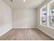 Bright, open living space with large windows and light wood flooring at 722 Crossroad Ct, Powder Springs, GA 30127