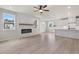 Bright and open living space with a modern fireplace and a view into the kitchen at 722 Crossroad Ct, Powder Springs, GA 30127