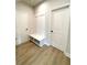 Charming mud room boasts a built-in bench with storage and coat hooks, perfect for staying organized at 722 Crossroad Ct, Powder Springs, GA 30127