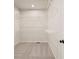 Spacious walk-in closet with white wire shelving and neutral carpeting for optimal organization and storage at 722 Crossroad Ct, Powder Springs, GA 30127