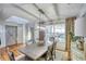 Inviting dining room with ample natural light and a stylish modern light fixture at 2853 Austin Ridge Dr, Dacula, GA 30019