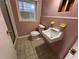 Small bathroom with pedestal sink and shower at 308 Mountain Brook Rd, Cumming, GA 30040