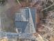 Aerial view of house showing gray roof, deck, and wooded surroundings at 3873 Wintergreen Ct, Marietta, GA 30062