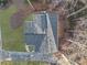 Aerial view of house showing gray roof, deck, and wooded surroundings at 3873 Wintergreen Ct, Marietta, GA 30062