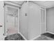 Basement hallway with tile flooring and storage at 4006 Maxanne Nw Dr, Kennesaw, GA 30144