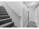 Basement stairs with carpeted steps and railing at 4006 Maxanne Nw Dr, Kennesaw, GA 30144