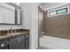 Clean bathroom with brown tile and granite countertop at 4006 Maxanne Nw Dr, Kennesaw, GA 30144
