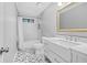 Updated bathroom with subway tile and patterned floor at 4006 Maxanne Nw Dr, Kennesaw, GA 30144