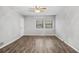 Large bedroom with wood-look floors and neutral walls at 4006 Maxanne Nw Dr, Kennesaw, GA 30144