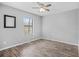 Spacious bedroom with wood-look floors and large window at 4006 Maxanne Nw Dr, Kennesaw, GA 30144