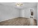 Bright bedroom featuring wood-look floors and ceiling fan at 4006 Maxanne Nw Dr, Kennesaw, GA 30144