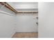 Walk-in closet with wood shelving and hanging rods at 4006 Maxanne Nw Dr, Kennesaw, GA 30144