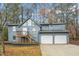 Two-story house with gray siding, attached two-car garage, and deck at 4006 Maxanne Nw Dr, Kennesaw, GA 30144