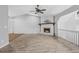 Living room with hardwood floors, a stone fireplace, and vaulted ceilings at 4006 Maxanne Nw Dr, Kennesaw, GA 30144