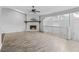 Spacious living room with a stone fireplace and hardwood floors at 4006 Maxanne Nw Dr, Kennesaw, GA 30144