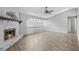 Living room with a stone fireplace and hardwood floors at 4006 Maxanne Nw Dr, Kennesaw, GA 30144