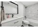 Basement bathroom with white vanity and marble tile at 6344 Century Park Se Pl, Mableton, GA 30126