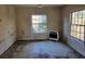 Empty bedroom with hardwood floors and two windows at 672 Rowland Rd, Stone Mountain, GA 30083