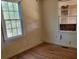 Empty bedroom with hardwood floors and two windows at 672 Rowland Rd, Stone Mountain, GA 30083