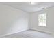 Bright bedroom with grey carpet and large window at 1608 Ruskin Way, Marietta, GA 30062