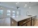 Kitchen island with white quartz countertop and dark cabinets at 1608 Ruskin Way, Marietta, GA 30062