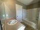 Clean bathroom with a tub, sink, and built-in shelving at 3116 Leyland Ct, Decatur, GA 30034