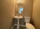 Small bathroom with pedestal sink and toilet at 3116 Leyland Ct, Decatur, GA 30034