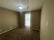 Bright bedroom with brown carpet and a large window at 3116 Leyland Ct, Decatur, GA 30034