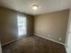 Simple bedroom with brown carpet and a window at 3116 Leyland Ct, Decatur, GA 30034