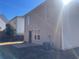 Exterior view of the house, showing gray siding and a patio at 3116 Leyland Ct, Decatur, GA 30034