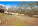 Sloped backyard with trees and shed at 326 Scarlett Ln, Woodstock, GA 30188