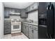 Small galley kitchen in the basement with grey cabinets at 326 Scarlett Ln, Woodstock, GA 30188