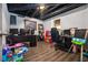 Finished basement room features two workspaces, built-in shelving, and hardwood floors at 326 Scarlett Ln, Woodstock, GA 30188