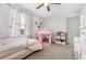 bedroom with a pink play tent and built in shelving at 326 Scarlett Ln, Woodstock, GA 30188