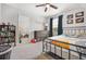 Bright bedroom with a metal bed frame and large window at 326 Scarlett Ln, Woodstock, GA 30188