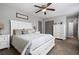 Spacious primary bedroom with ceiling fan, carpet, and ample closet space at 326 Scarlett Ln, Woodstock, GA 30188