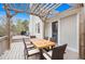 Relaxing deck with pergola, dining table, chairs, and grill at 326 Scarlett Ln, Woodstock, GA 30188