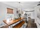 Farmhouse-style dining room with wooden table and bench at 326 Scarlett Ln, Woodstock, GA 30188