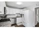 Modern kitchen with white cabinets, granite countertops, stainless steel appliances, and subway tile backsplash at 326 Scarlett Ln, Woodstock, GA 30188