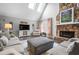 Large Gathering room featuring a stone fireplace and skylights at 326 Scarlett Ln, Woodstock, GA 30188