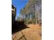 Expansive backyard with tree coverage at 5250 Mountain Village Ct, Stone Mountain, GA 30083